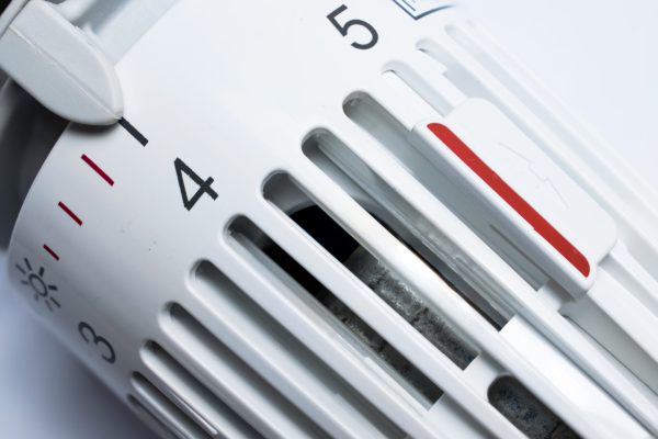 Thermostat of an heating radiator on white background.