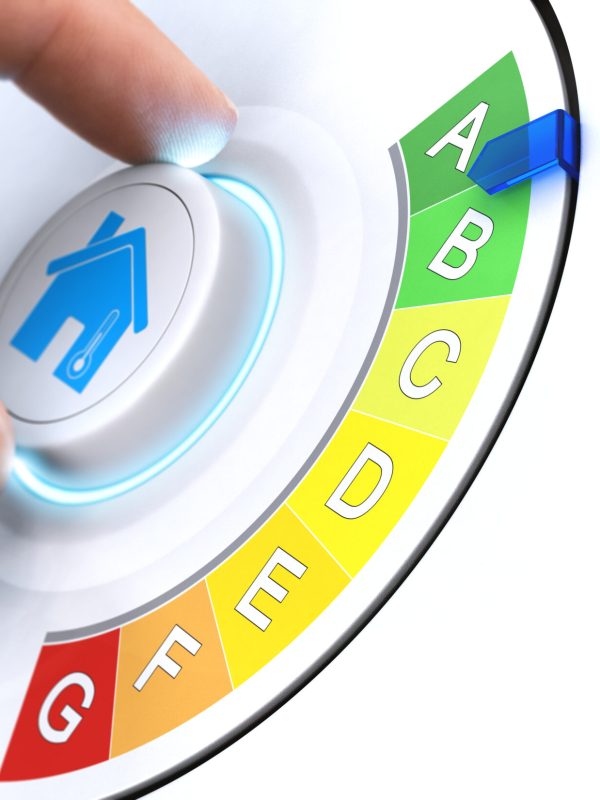Hand turning a knob to make a home more energy efficient . Composite image between a hand photography and a 3D background.