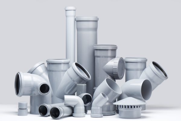 Plumbing, sewage. Gray polypropylene tubes on a white background in futuristic style
